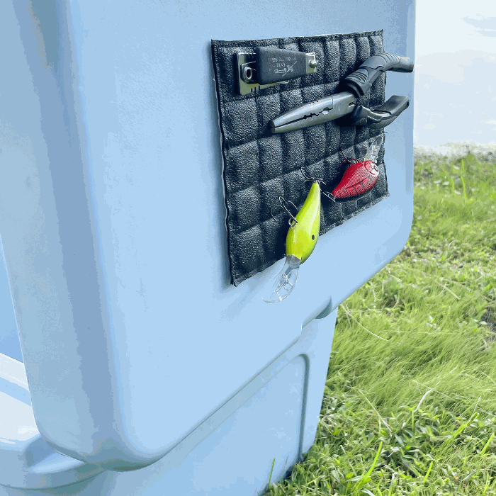 Magnalure Sticky Pad attached to a cooler holding fishing lures and tools.